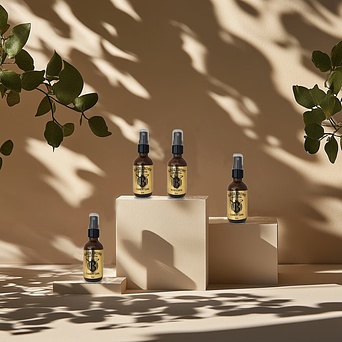 Black Crown Hair Cologne bottles displayed in natural light